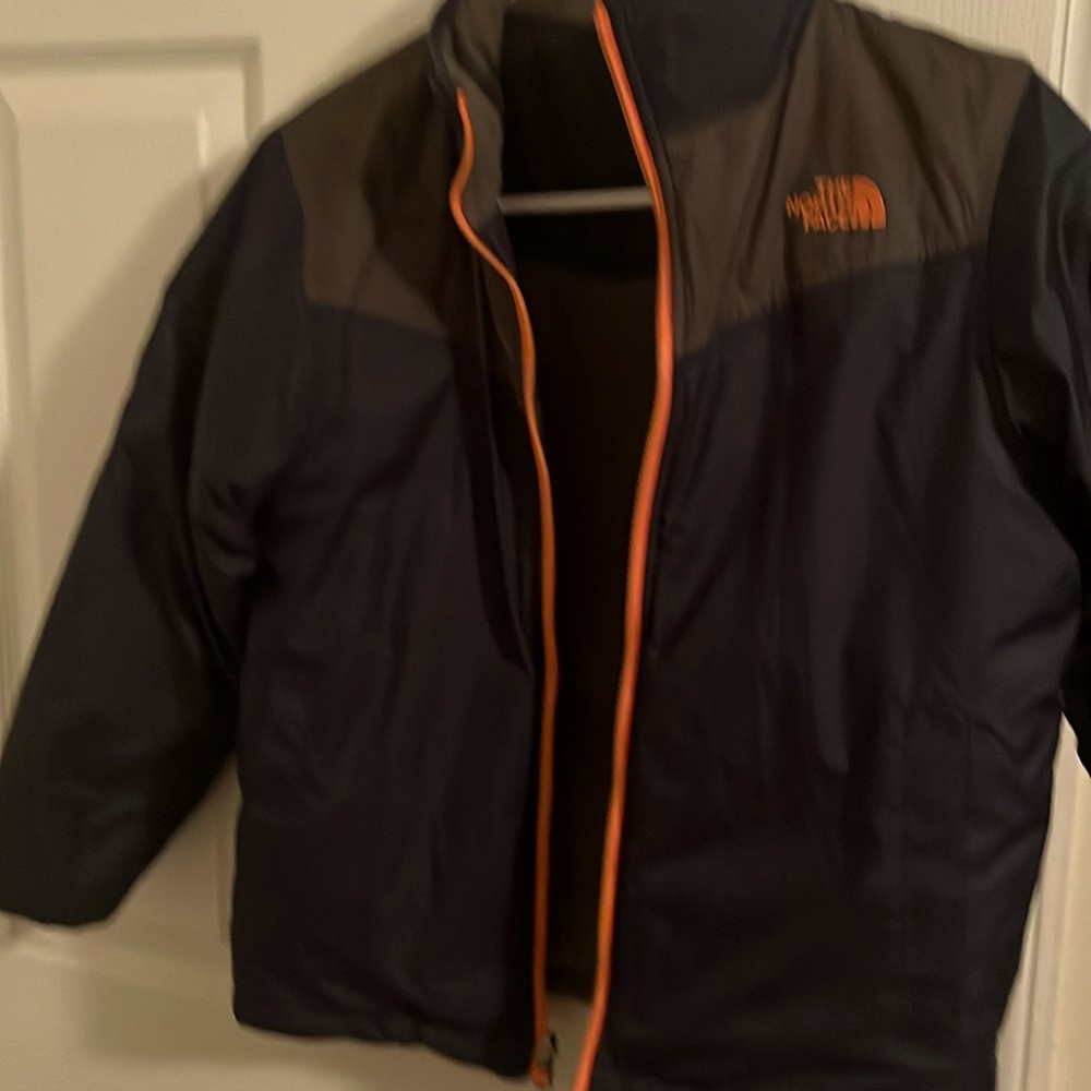 North face reversible gray and blue down jacket.